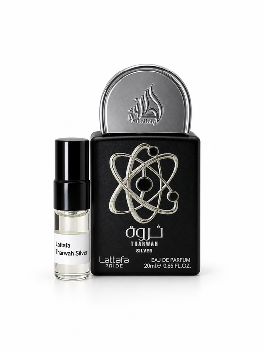 Lattafa Pride Tharwah Silver fragrance bottle and black-capped sample vial on white