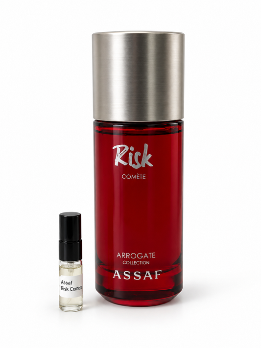 Assaf Risk Comete fragrance bottle and black-capped sample vial on white