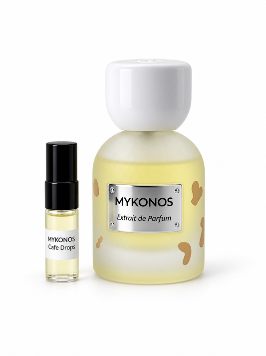 Mykonos Cafe Drops fragrance bottle and black-capped sample vial on white