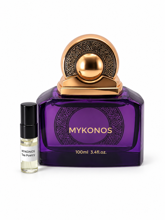 Mykonos Tea Poetry fragrance bottle and black-capped sample vial on white