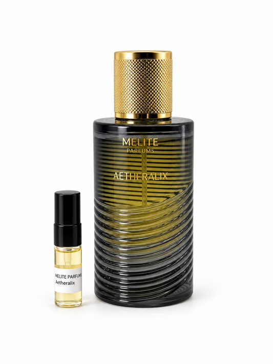 Melite Parfums Aetheralix fragrance bottle and black-capped sample vial on white