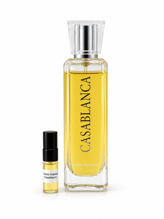 Swiss Arabian Casablanca fragrance bottle and black-capped sample vial on white