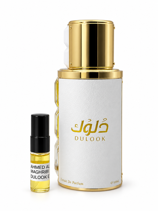 Ahmed Al Maghribi Dulook fragrance bottle and black-capped sample vial on white