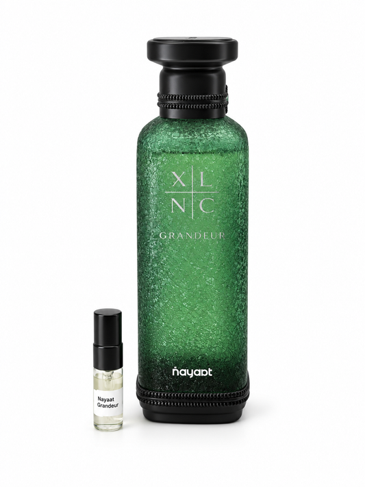 Nayaat XLNC Grandeur fragrance bottle and black-capped sample vial on white