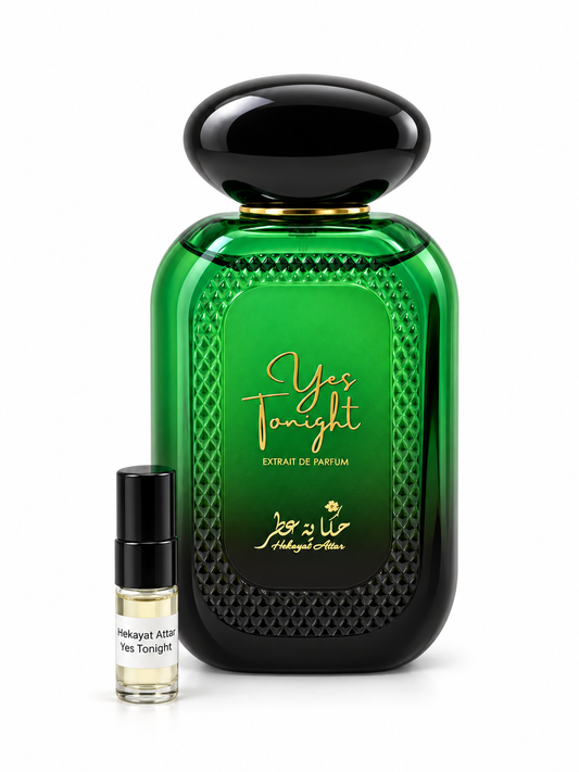 Hekayat Attar Yes Tonight fragrance bottle and black-capped sample vial on white