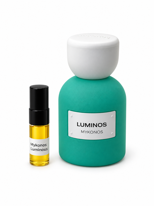 Mykonos Luminous fragrance bottle and black-capped sample vial on white