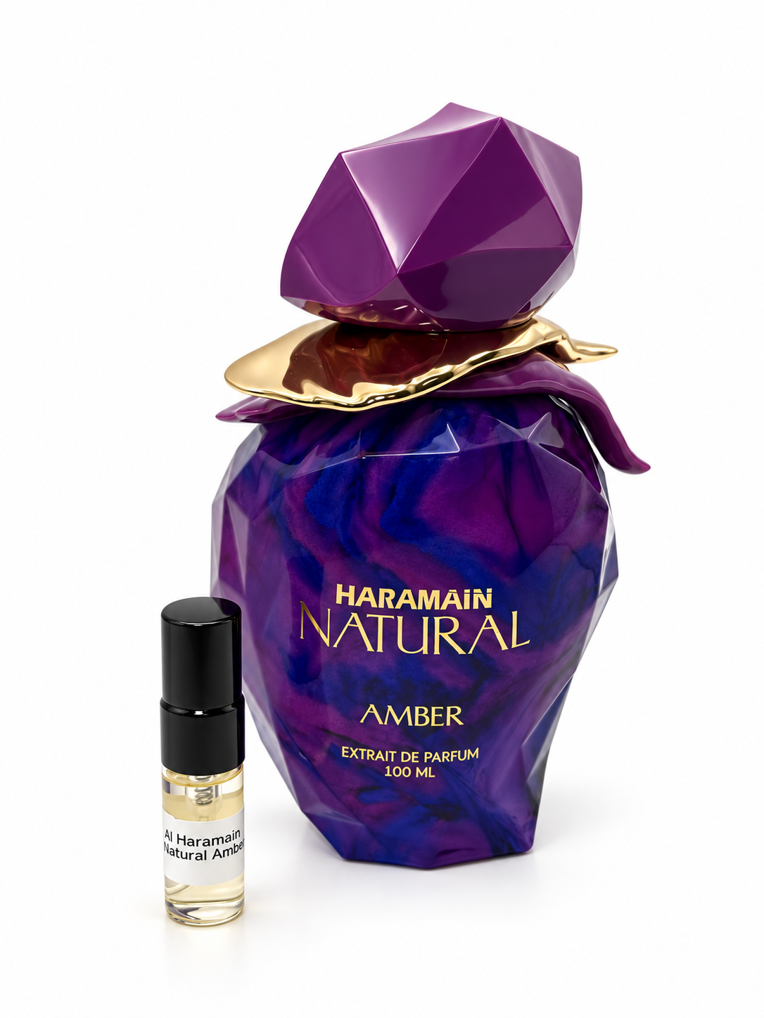 Al Haramain Natural Amber fragrance bottle and black-capped sample vial on white
