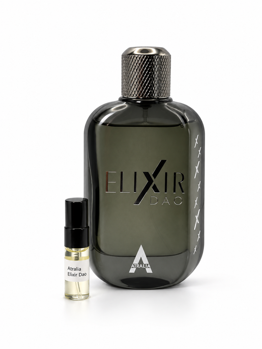 Atralia Elixir Dao fragrance bottle and black-capped sample vial on white