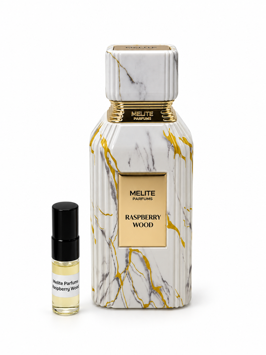 Melite Parfums Raspberry Wood fragrance bottle and black-capped sample vial on white