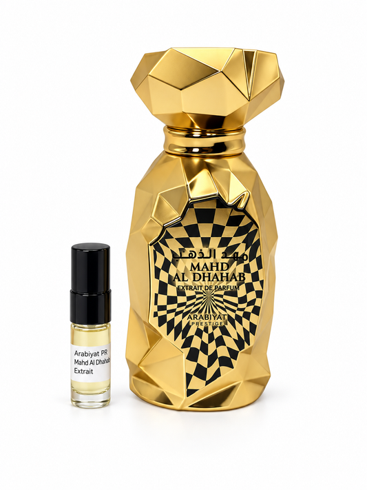 Arabiyat Prestige Mahd Al Dhahab Extrait fragrance bottle and black-capped sample vial on white