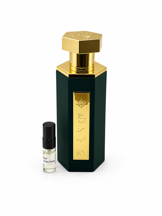Reef Arab Obiah fragrance bottle and black-capped sample vial on white