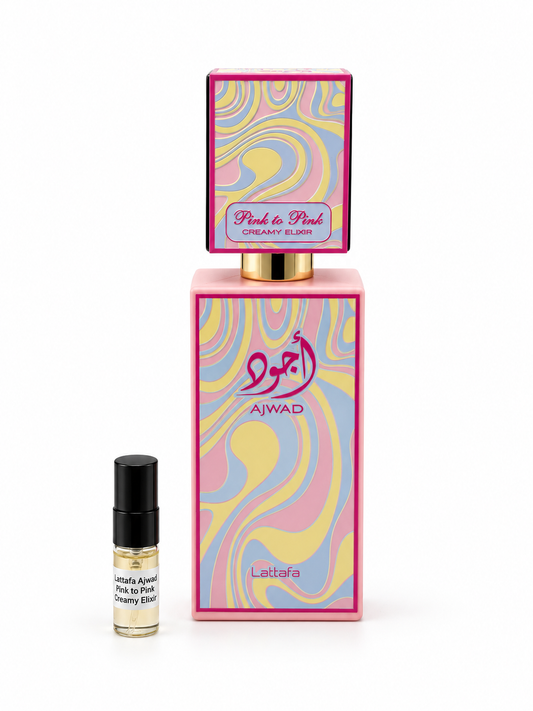 Lattafa Ajwad pink to pink Creamy Elixir fragrance bottle and black-capped sample vial on white